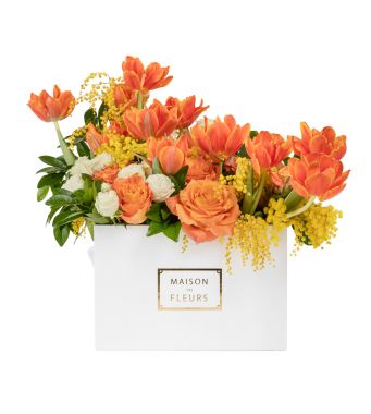 Expertly arranged flowers in vivid shades of spring in a 30 cm square white box configurable