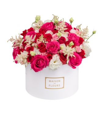 Stunning pink and red roses amidst special mixed flowers in a 30cm round box